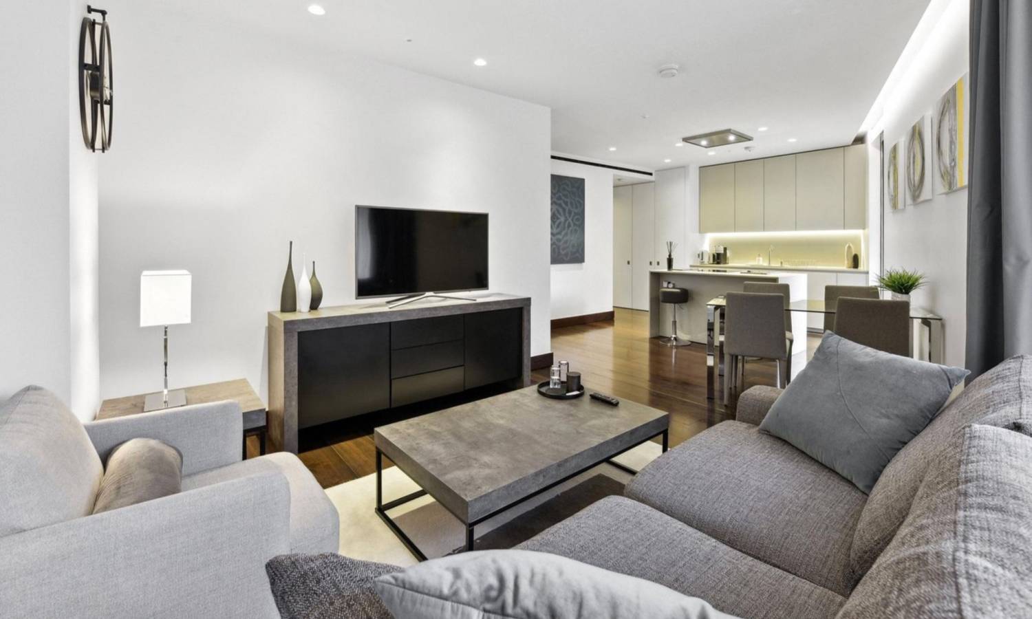 A photorealistic view of the luxury modern lobby of Kings Gate development in Westminster London, with limestone walls and concierge desk, daytime.